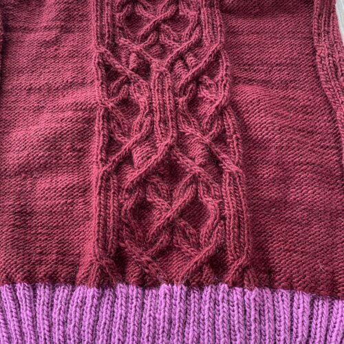 Back Panel of Anfractuous Sweater, Burgundy with Orchid hem and shoulders, a bit rumply - unwashed and unblocked